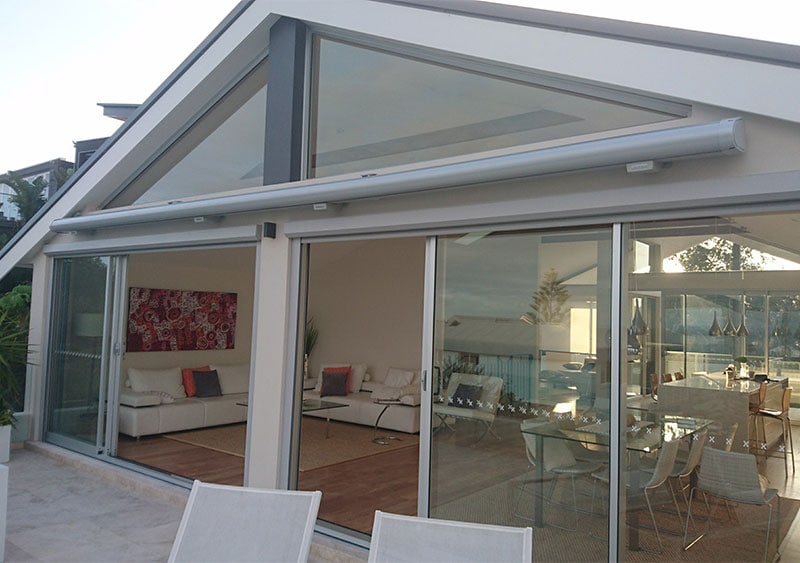 A glass house with an awning that didn't yet use