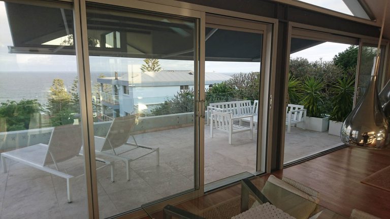 Glass doors featuring an outdoor patio